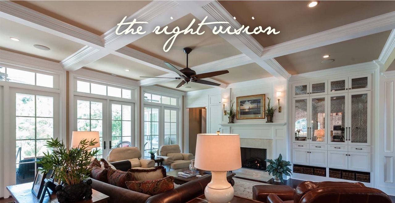 Renovated coffered-ceiling living room with built-in cabinetry and a fireplace.